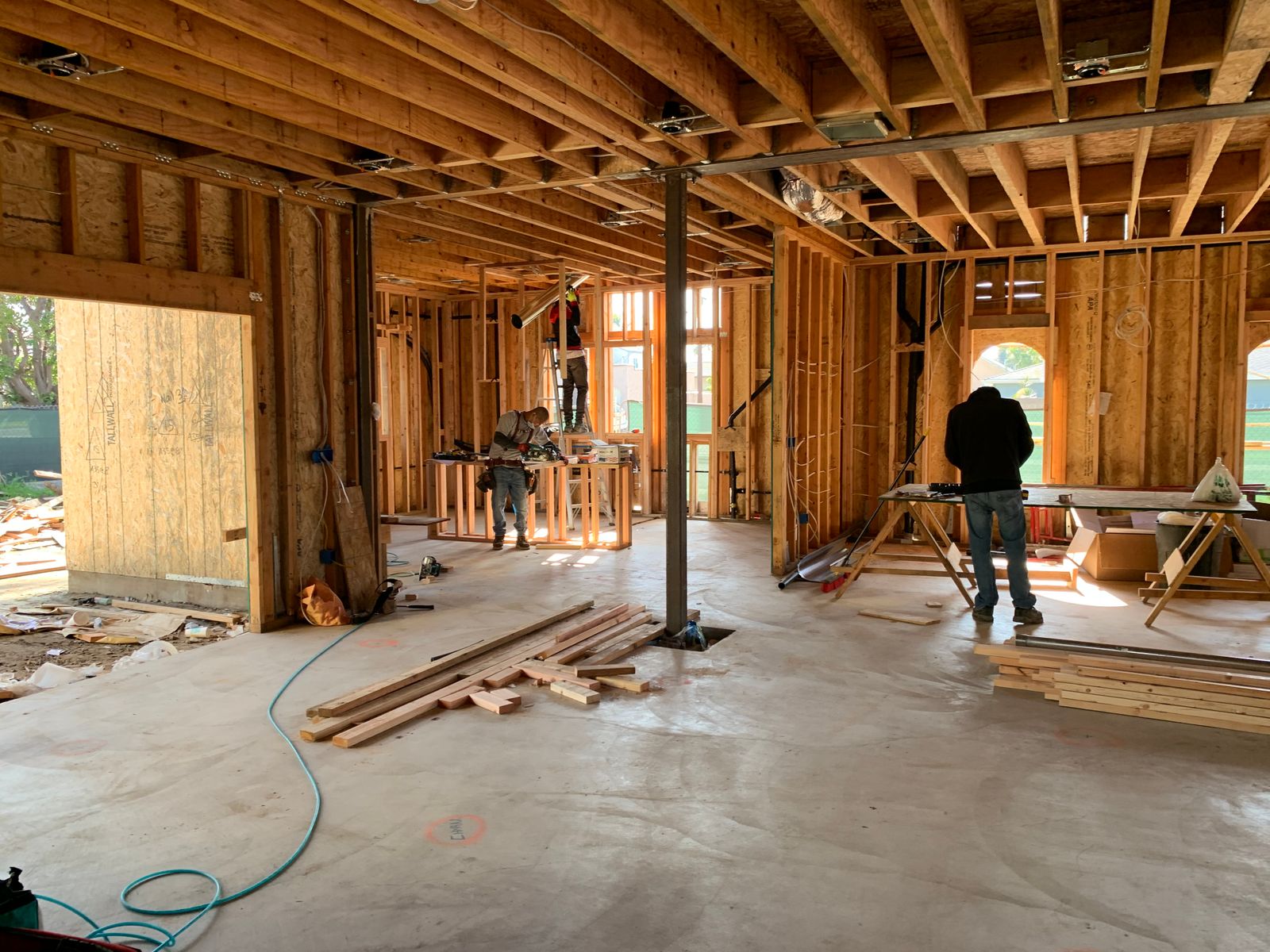 Site team building an interior framework — the kind of fitout where verbal scope changes routinely never reach the progress claim