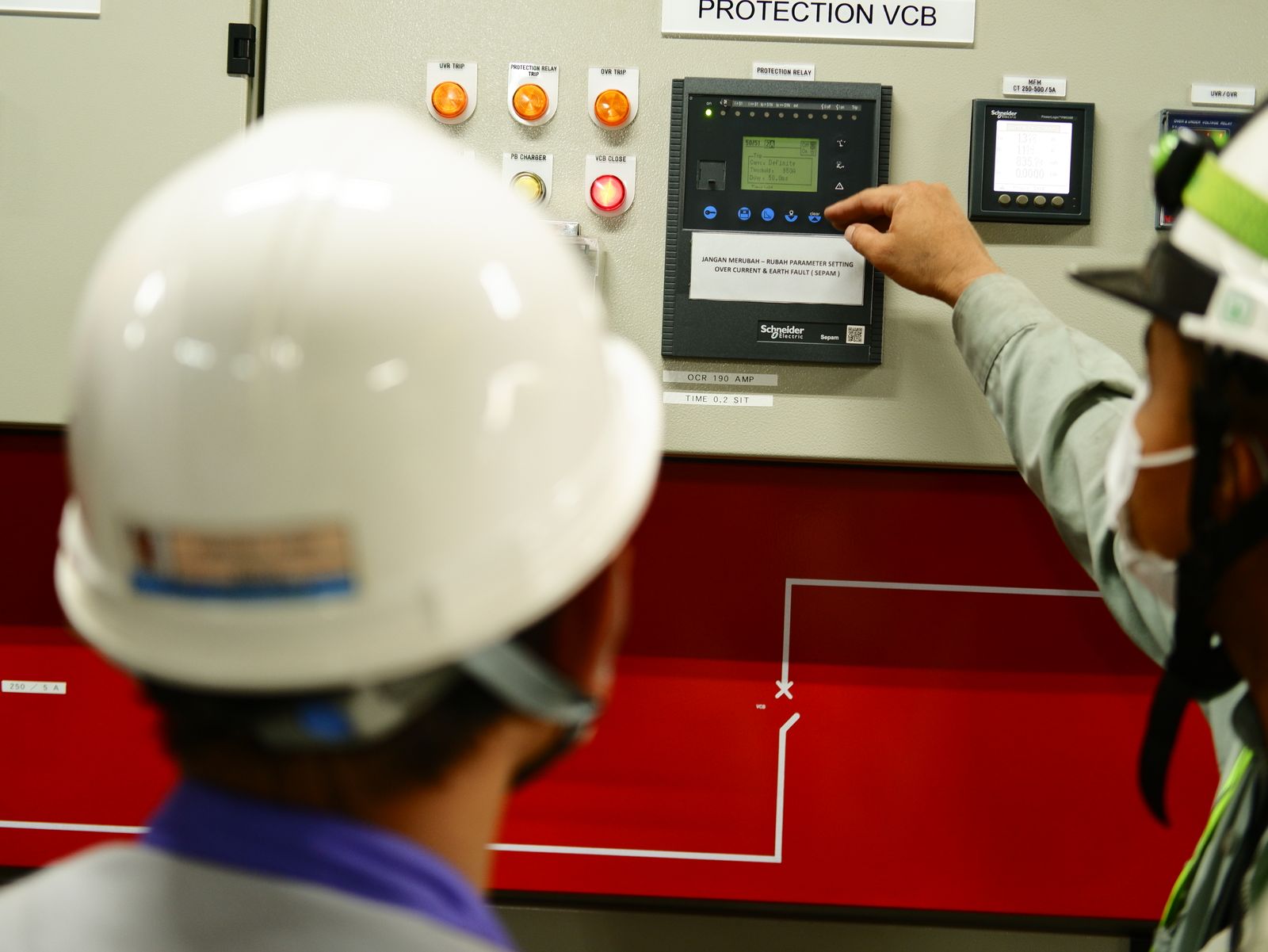 Engineers operating a connected control panel — the same idea applied to the platforms your electrical business already runs