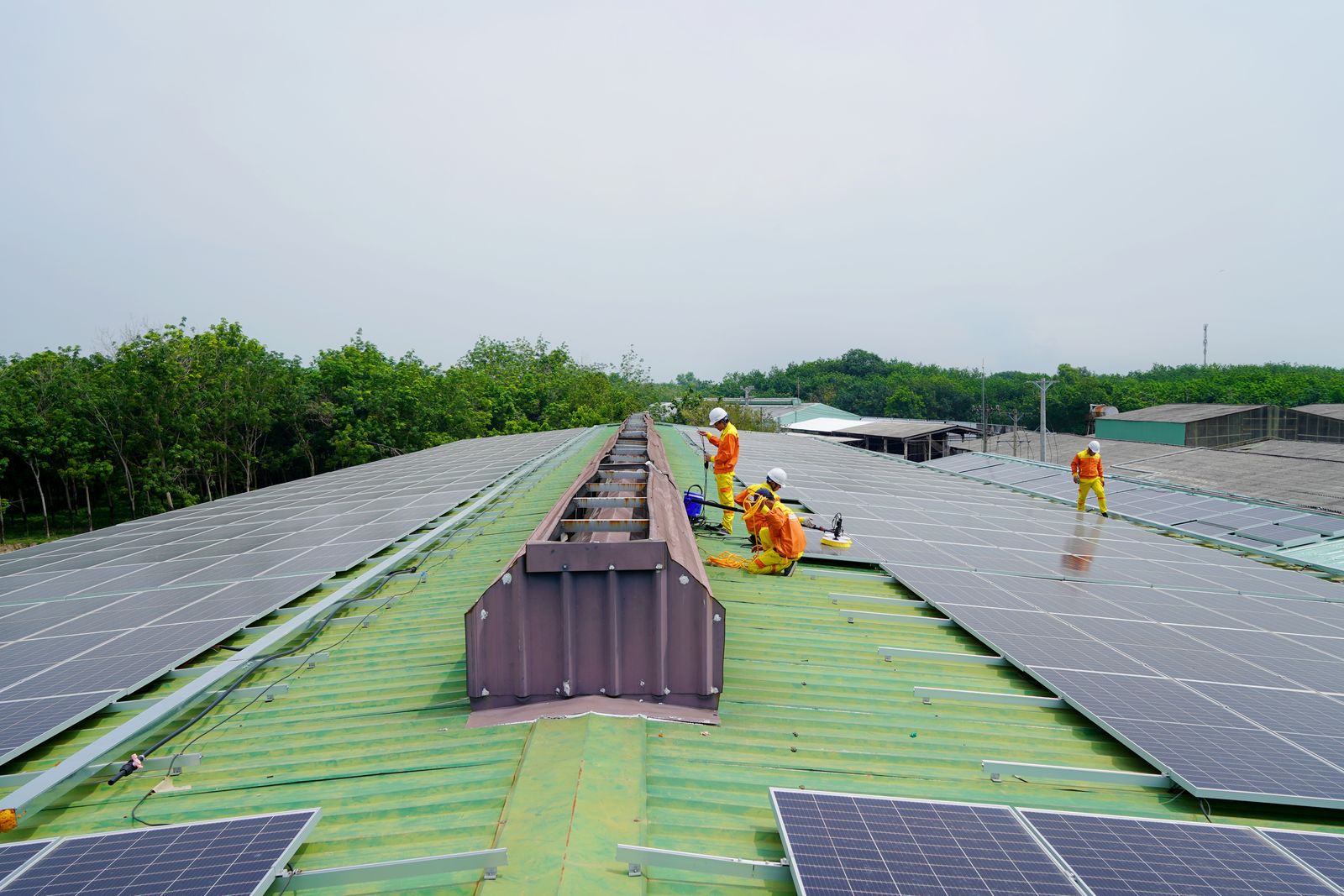 Electricians installing rooftop solar PV — field crews working remotely where signal often drops out