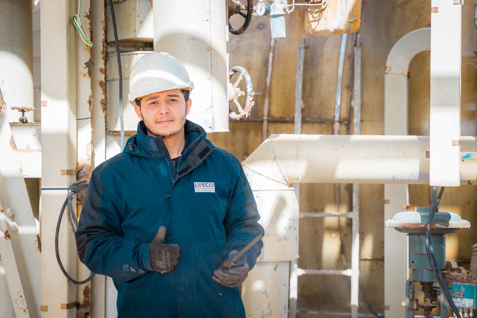Gas engineer in protective gear at an industrial facility — automation that runs the repeatable parts of the operation so the team focuses on the work