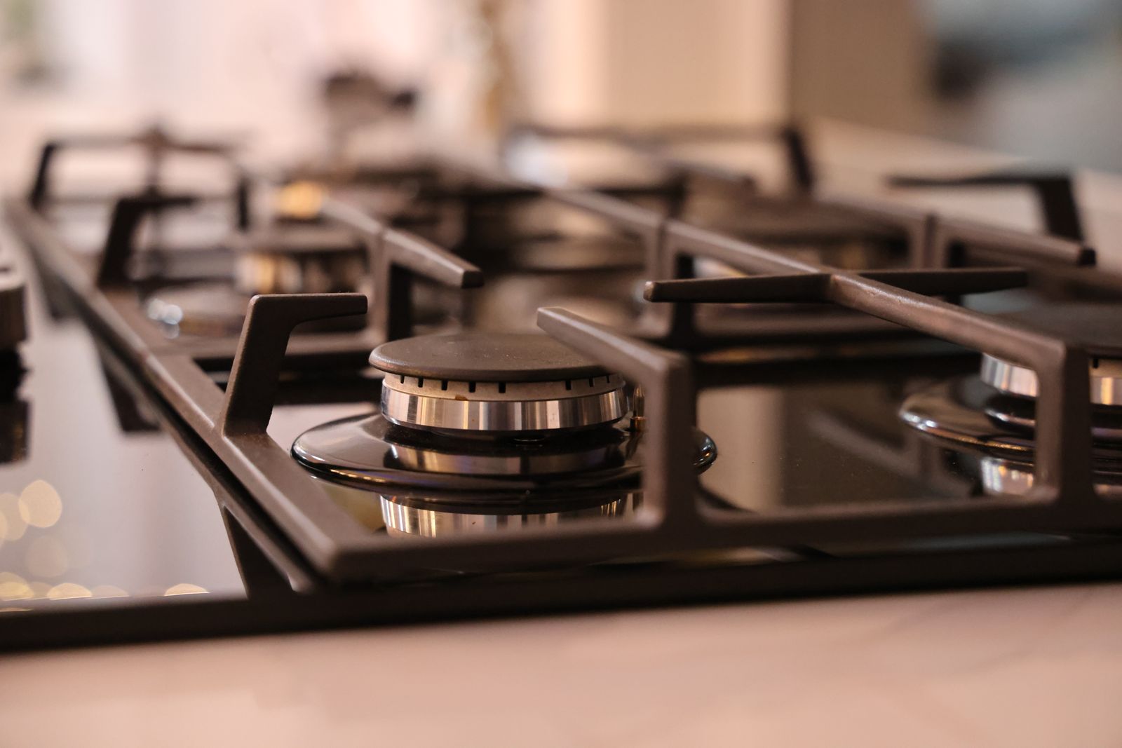 Modern stainless steel gas cooktop — the kind of appliance install that often needs both a GCC and an electrical CES