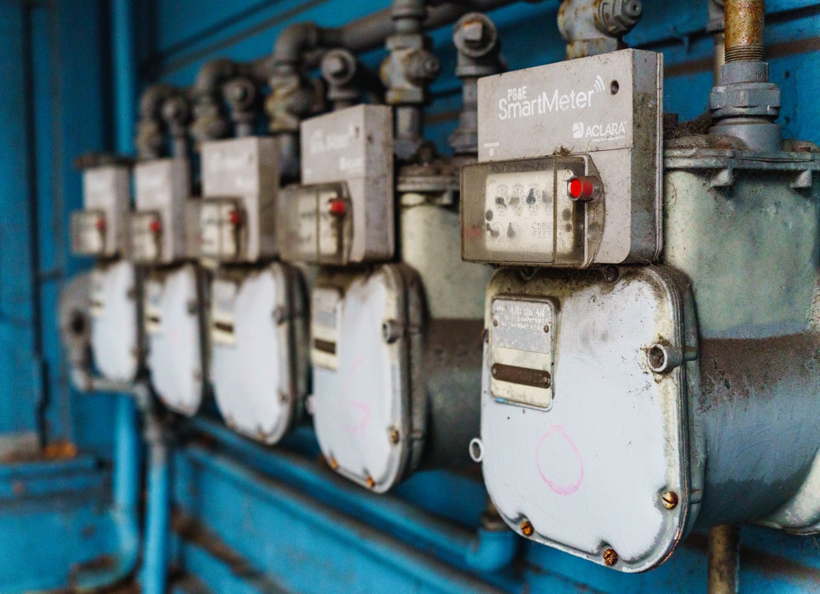 Row of gas meters on a multi-unit wall — the kind of rental portfolio that drives a recurring CO-testing program