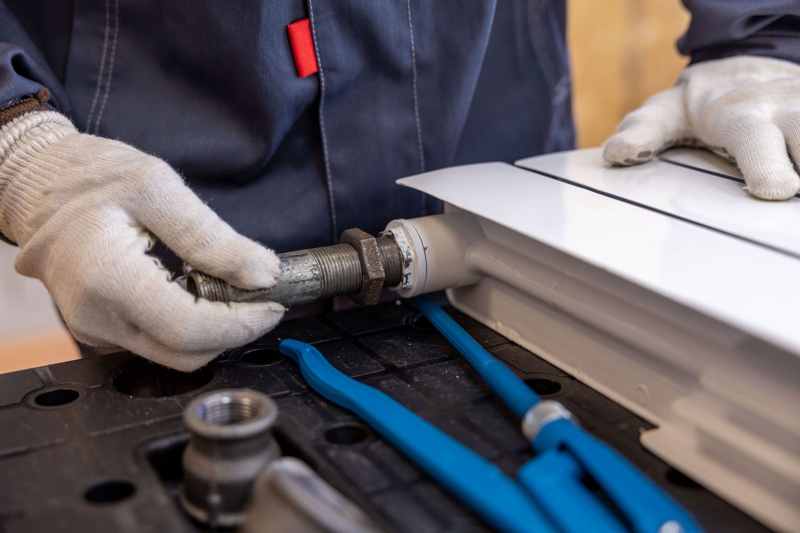 Plumber installing a fixture — but which work type carries the margin? Most operations cannot answer without weeks of digging