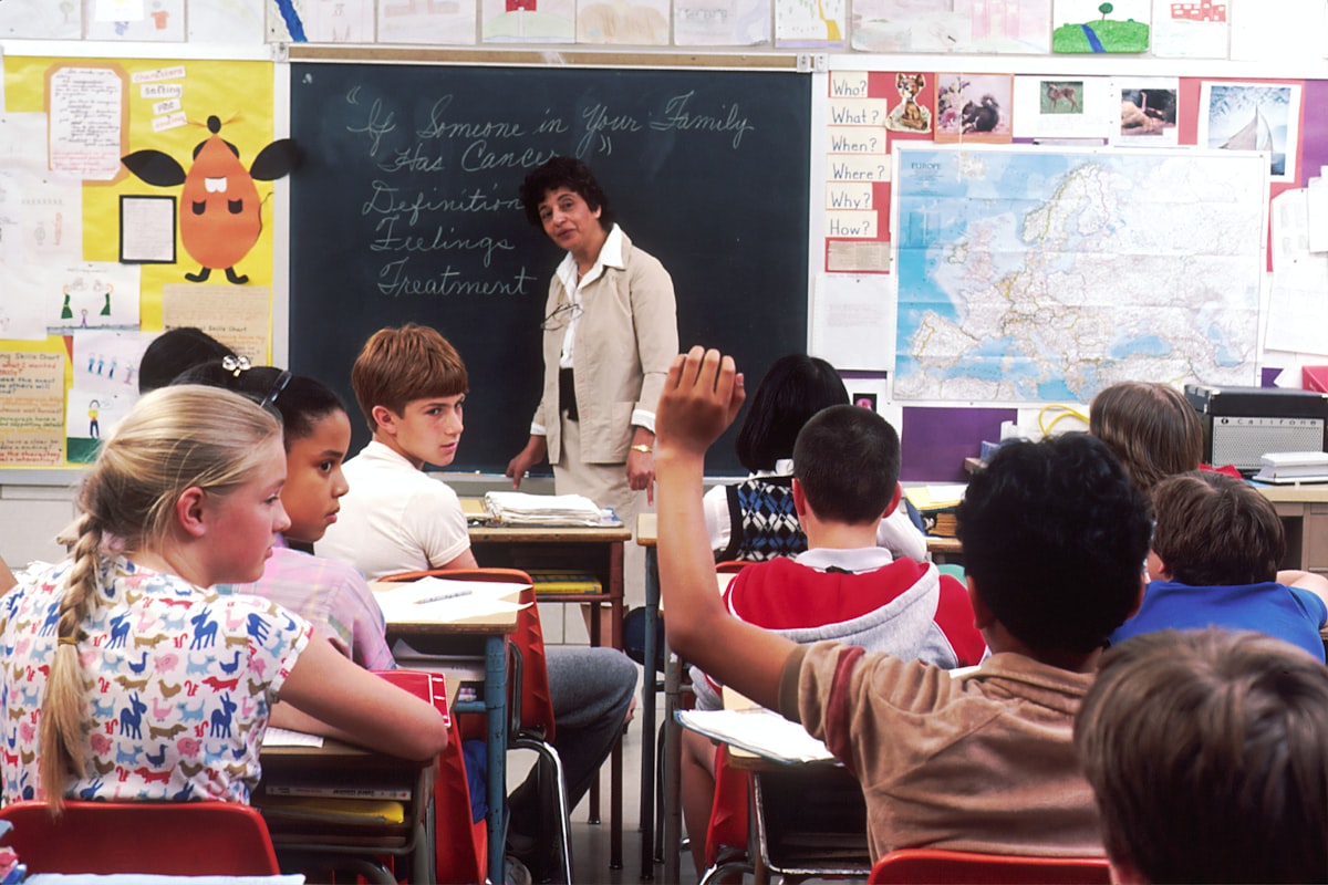 Parent reading school announcements and messaging a teacher through the portal