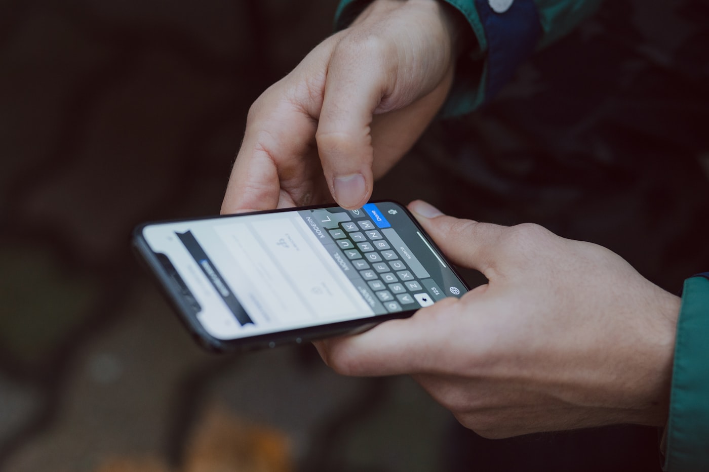 Business professional checking SMS notifications on smartphone